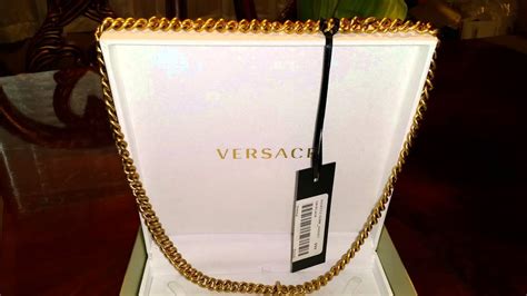 how to spot fake versace necklace